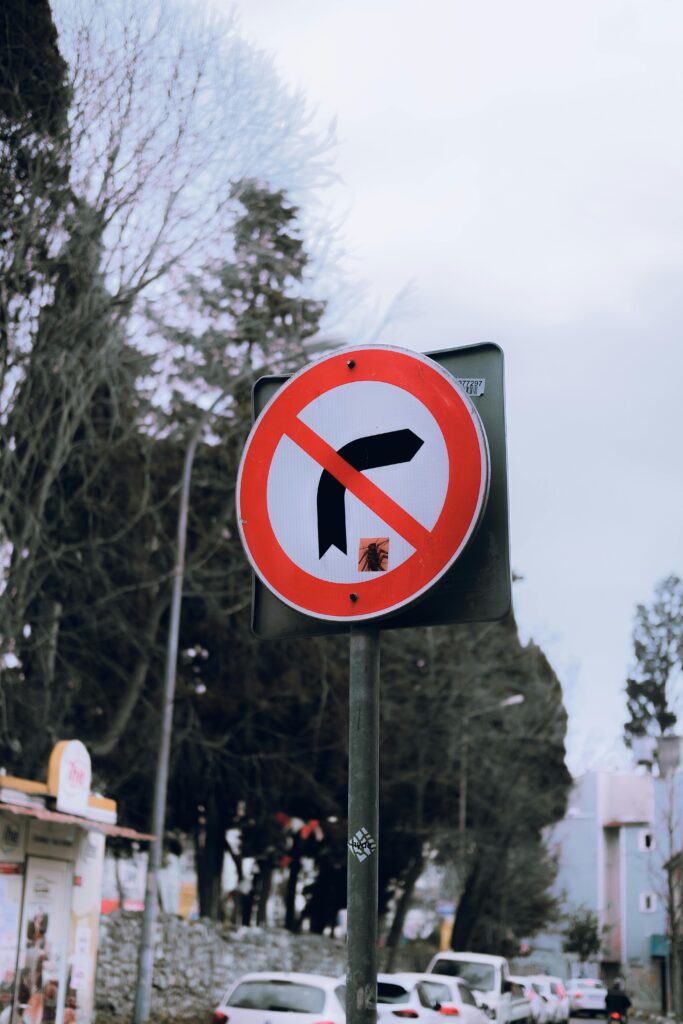 pexels photo 15832333 15832333 Vividly captures a no right turn traffic sign in a bustling city street, portraying clear signage and compliance.